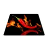 Skleněné prkénko paprika chilli v ohni